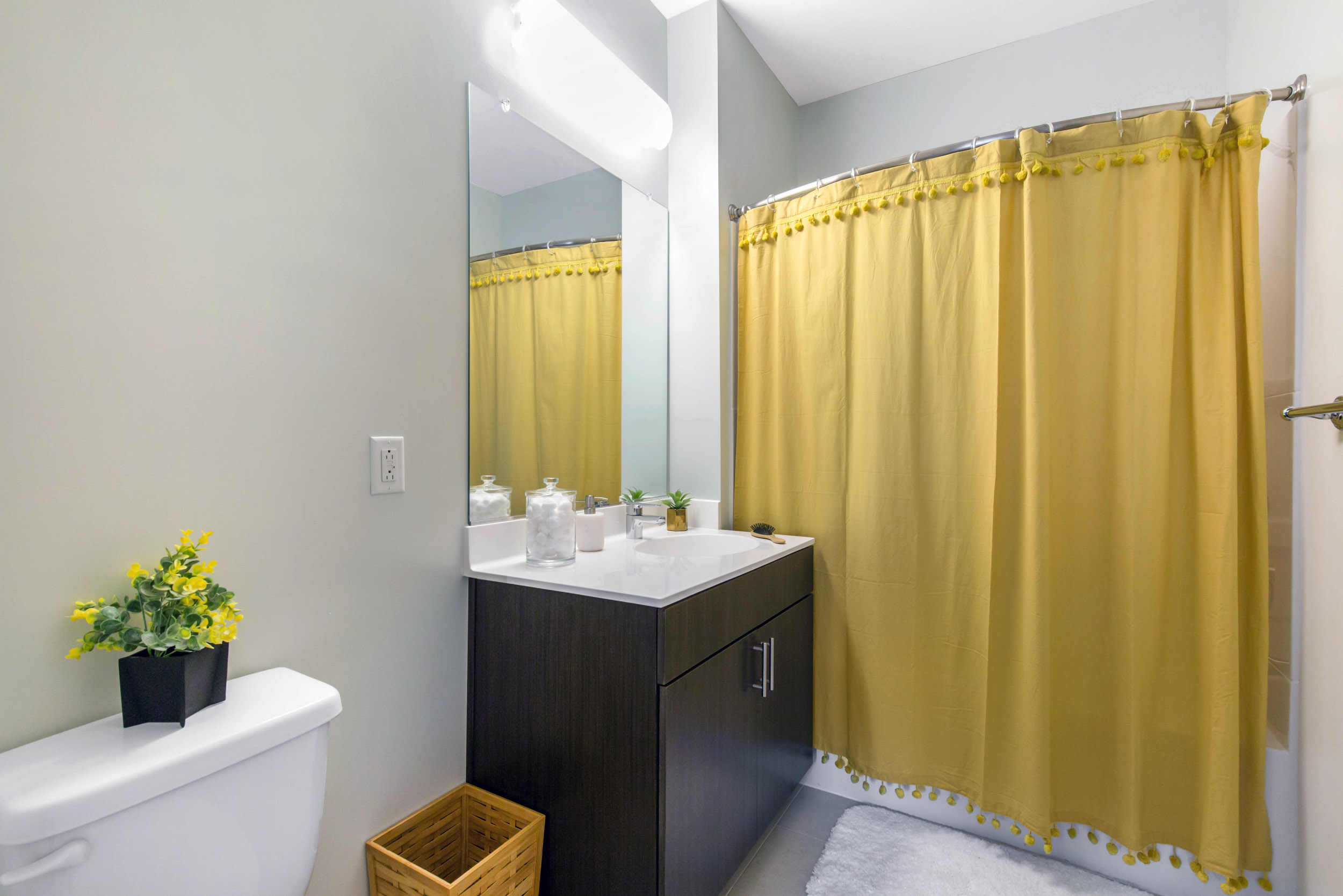 Bathroom with yellow flowers and shower curtain