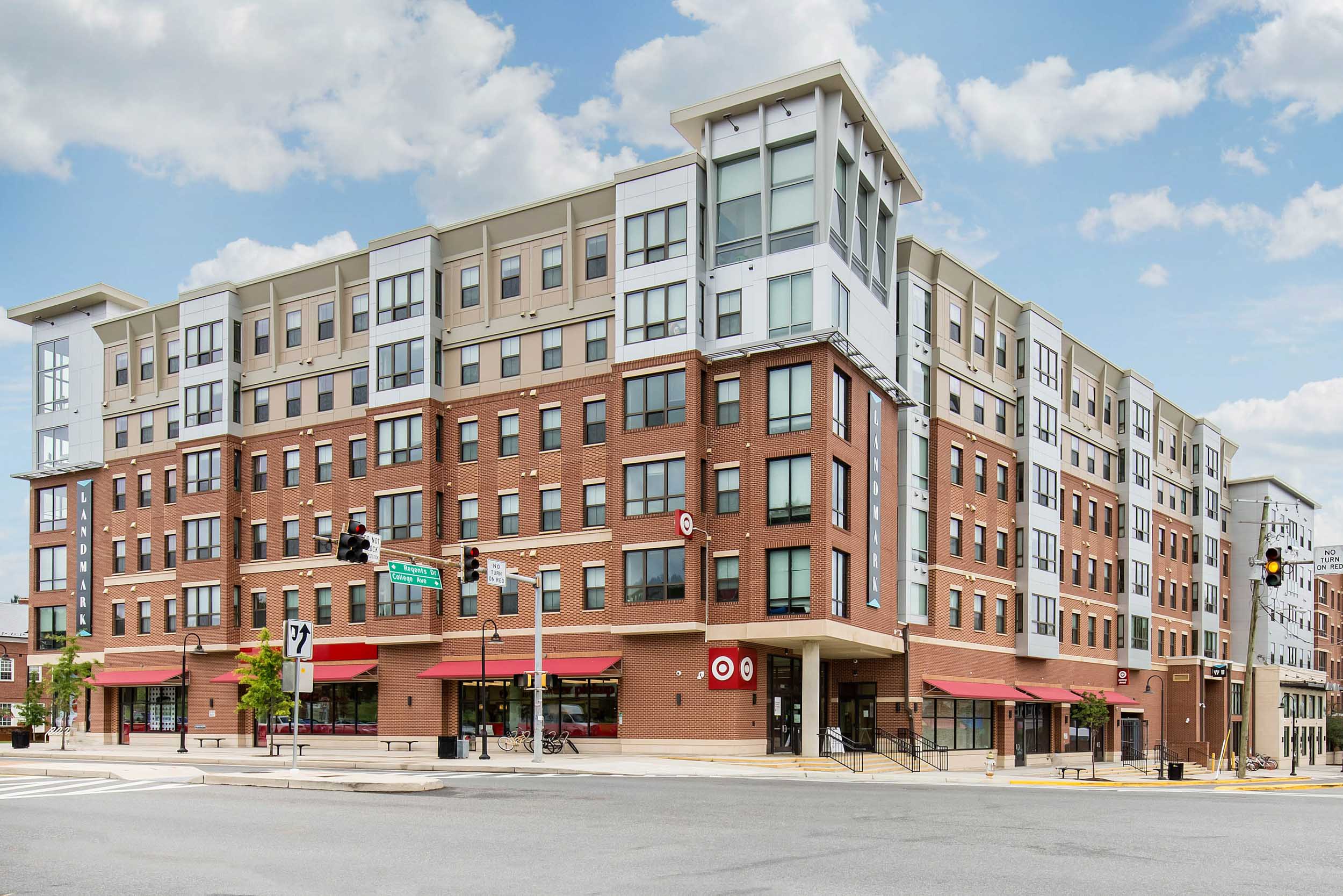 Brick apartment building with retail stores along the street level